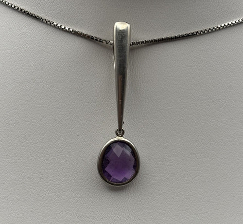 Amethyst drop stone close-up, natural purple