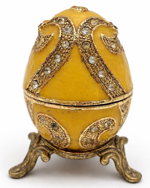 Faberge style yellow enamel egg trinket box on stand, jewelled