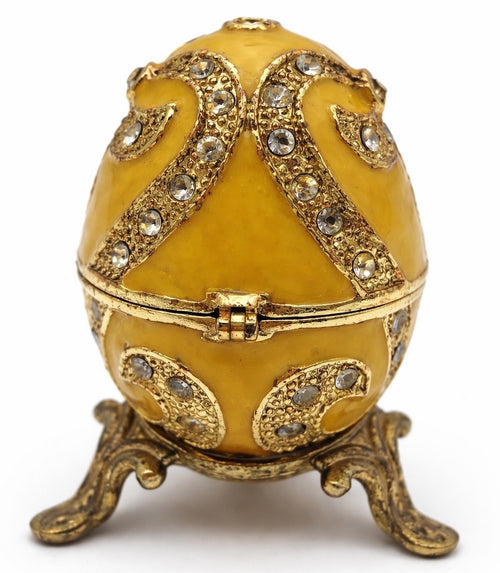 Yellow enamel and jewel detail on egg box