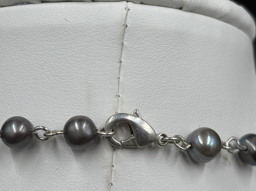 Multi grey freshwater pearls close-up, hand linked