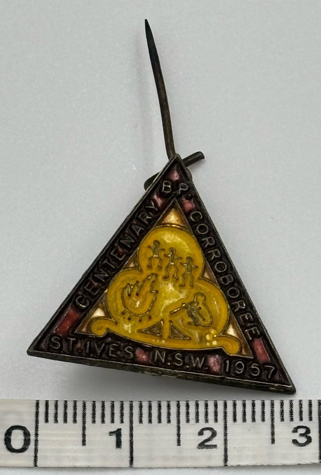1957 badge, angled view