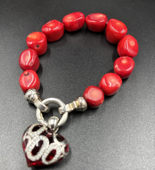 Silver love heart charm close-up on Kagi bracelet